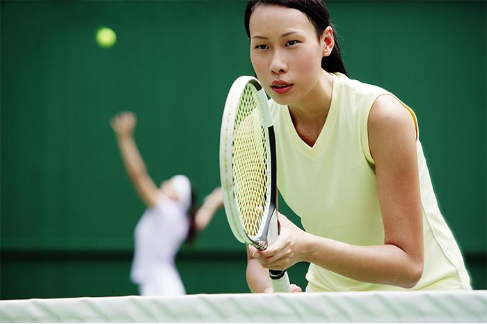 Photo of a woman playing tennis