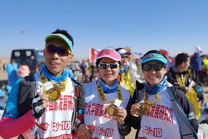 Members of the team competing in the desert with their medals